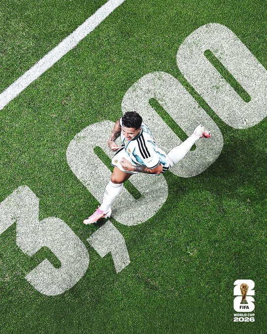 A soccer player in Argentina's white and light blue striped jersey celebrates in mid-air over the grass field, with a large "3000" graphic displayed on the pitch and the FIFA World Cup 2026 logo in the corner, visually representing the milestone achievement referenced in the caption about turning accomplishments into history.