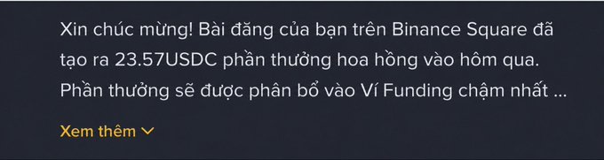 A Vietnamese notification from Binance Square congratulating the user on earning 23.57 USDC in commission rewards, with the post expressing encouragement about the modest but motivating payout. The notification text reads: "Xin chúc mừng! Bài đăng của bạn trên Binance Square đã tạo ra 23.57USDC phần thưởng hoa hồng vào hôm qua. Phần thưởng sẽ được phân bổ vào Ví Funding chậm nhất..." with a "Xem thêm" (See more) link below.