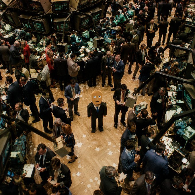 The image shows a crowded New York Stock Exchange trading floor, with brokers in suits surrounded by scattered papers, ticker boards, and trading terminals, while a cardboard robot figure stands alone and unnoticed in the center—humorously embodying the "first to show up, last to leave" dedication of floor traders.