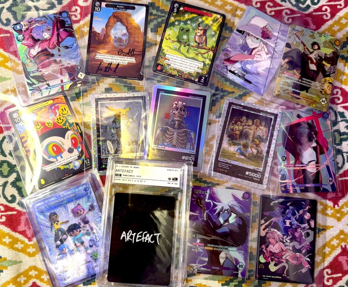 A collection of rare NFT cards—including Beeple, Astrobot, Azuki, JB, and Pudgy pieces—is displayed on a patterned rug, with visible numbered limited editions such as #6101, #5000, and an "ARTEFACT" graded card, illustrating the post's claim of a five-figure investment in 150+ Web3 collectibles poised to rise together.