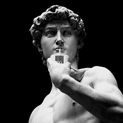 𝕏 is a famous artist who created the sculpture of David. The image shows him holding a drink with a straw while posing for the camera. The post about him has been shared by someone named "Wallchain" and has received over 700 likes, indicating that it's gaining popularity among viewers.
