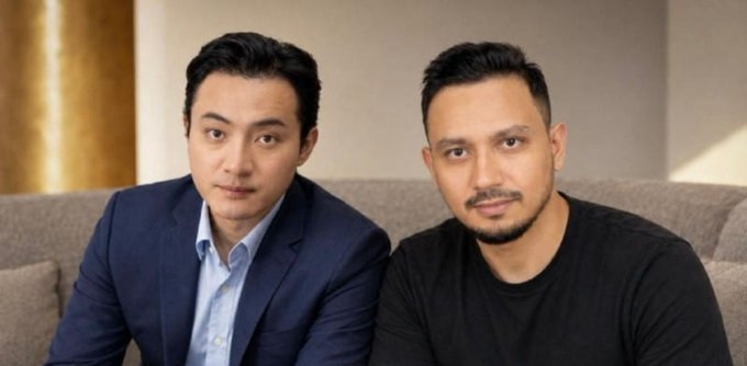 Two men in business-casual attire sit together on a gray couch in what appears to be a professional portrait, with the accompanying post discussing Polygon's new TRON integration to bridge the TRON network's ~$94 billion USDT liquidity into Polygon's stablecoin ecosystem for cross-border transfers.