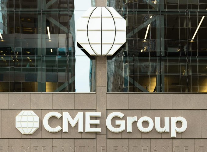 The exterior of a CME Group building features the company's signature globe logo and "CME Group" signage alongside the Chicago Mercantile Exchange name, providing institutional context for the exchange's launch of UNI futures contracts.