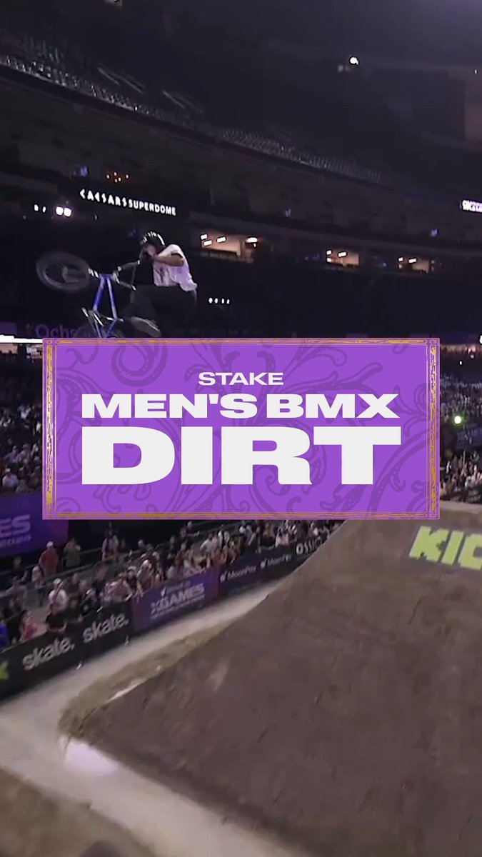 A BMX rider executes an aerial trick mid-flight above a dirt ramp at the X Games inside the Caesars Superdome, with a bold purple overlay reading "STAKE MEN'S BMX DIRT" capturing the intense focus of competition—perfectly embodying what it means to be "locked in."