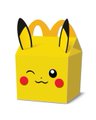 A small yellow cube-shaped paper craft or figurine designed to look like Pikachu's face with black-tipped ears and red cheeks.