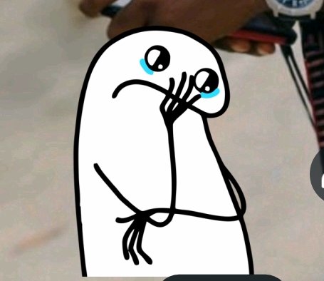 A cartoon ghost-like character with teary eyes covering its mouth, with a person's hand and watch visible in the background.