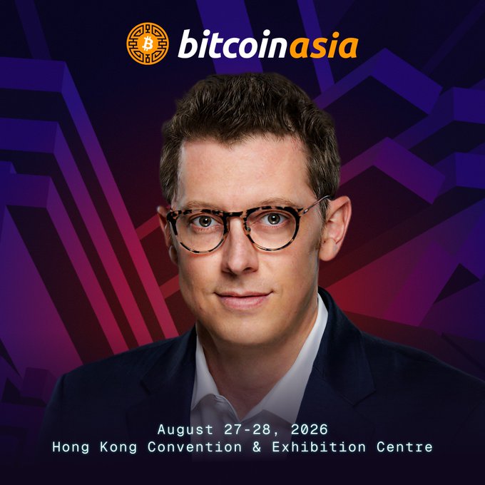 The image features a man wearing glasses, standing against a purple background with a logo for Bitcoin Asia. The man appears to be smiling at the camera, possibly posing for a promotional photo or event related to Bitcoin. The text "Bitcoin brings hope and inspires a better future." is written in the image, which suggests that the man might be speaking about the positive impact of Bitcoin on society.