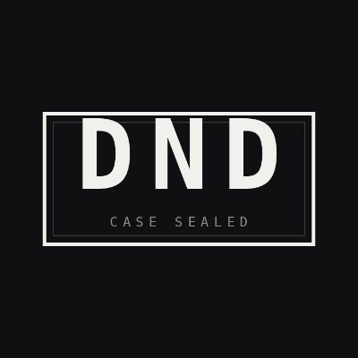 A black background displaying a white rectangular badge with bold text reading 'DND' and smaller text 'CASE SEALED' beneath it.