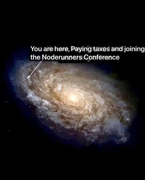 A meme featuring a galaxy with text reading 'You are here, Paying taxes and joining the Noderunners Conference,' with an arrow pointing to a small part of the spiral.