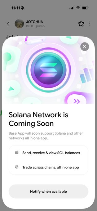 The image is of an old cellphone with the screen displayed, showing a message from @solana network about their upcoming mobile app called Solana Network. The background of the screen shows different images such as a green circular logo, and some other text like "Solana is coming soon" and "@solana network".