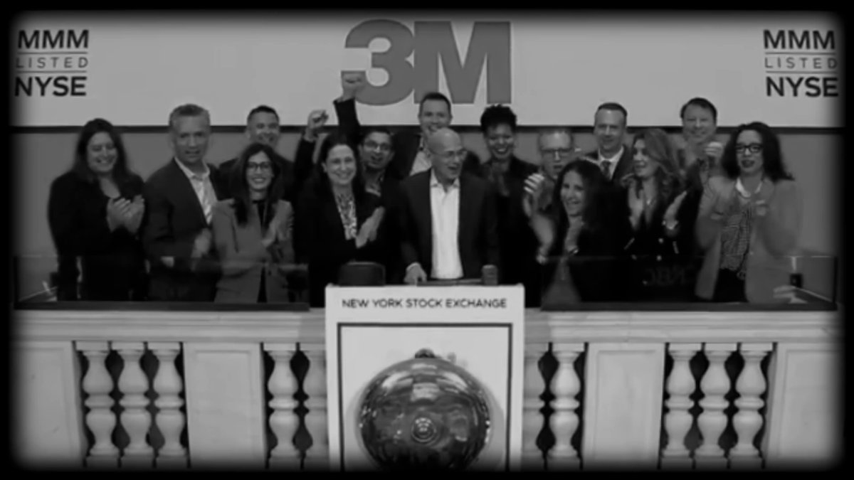 The image features a group of people standing behind a podium at a trading event for tokenized stocks, ETFs, and RWA tokens. The people appear to be celebrating or acknowledging something related to the event. There are several individuals visible in the photo, including one person holding up their hand in a gesture of victory or accomplishment.

The backdrop of the image is a large sign that reads "3M", which indicates that this event is taking place at a company named 3M. The people and the setting suggest that they might be celebrating the successful launch or announcement of a new tokenized trading platform, such as SynFutures' tokenized RWA tokens.