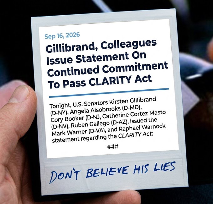 A hand holds a press release dated Sep 16, 2026, announcing that Senators Gillibrand, Alsobrooks, Booker, Cortez Masto, Gallego, Warner, and Warnock issued a statement reaffirming their commitment to passing the CLARITY Act, with a handwritten caption "DON'T BELIEVE HIS LIES" scrawled across the bottom—matching the post's skepticism toward the senators' vow to keep working on the legislation.