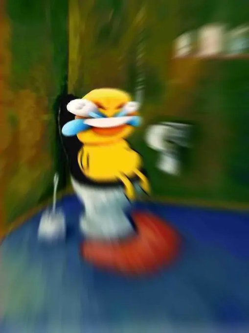 A blurry image of a crying yellow cartoon duck character sitting on a toilet in a bathroom.