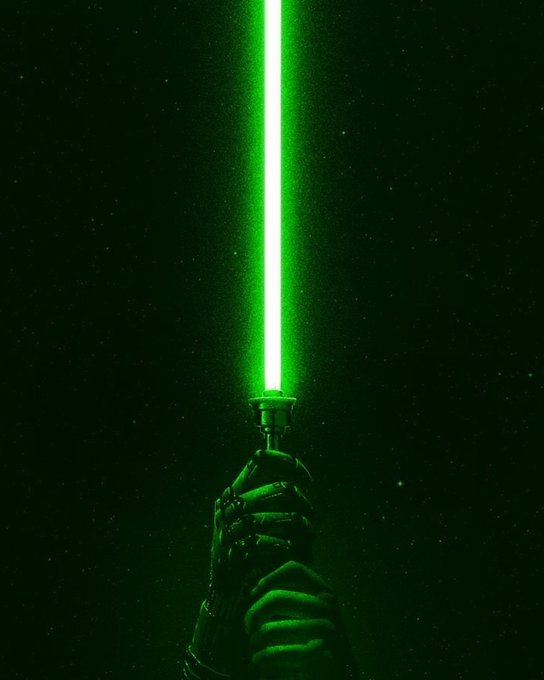 A gloved hand grips a lightsaber whose green blade blazes upward against a star-filled black sky, visually capturing the "feeling green" mood with its signature emerald glow piercing the darkness.