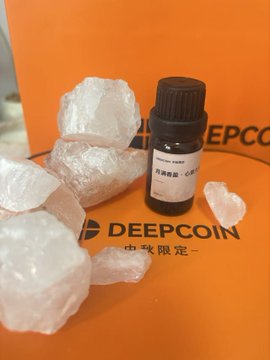 A small brown bottle labeled 'BENINCASA' displayed among clear quartz crystals on a DEEPCOIN branded surface.