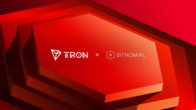 The image features an advertisement for a cryptocurrency called Bitnomial. The background of the image is red with white text that says "TRON Network continues to expand its compliant market access capabilities, with TRX recently listing on the Bitominal exchange and clearinghouse regulated by the U.S. CFTC". The main focus of the image is a red hexagon placed in the center, surrounded by smaller red hexagons.