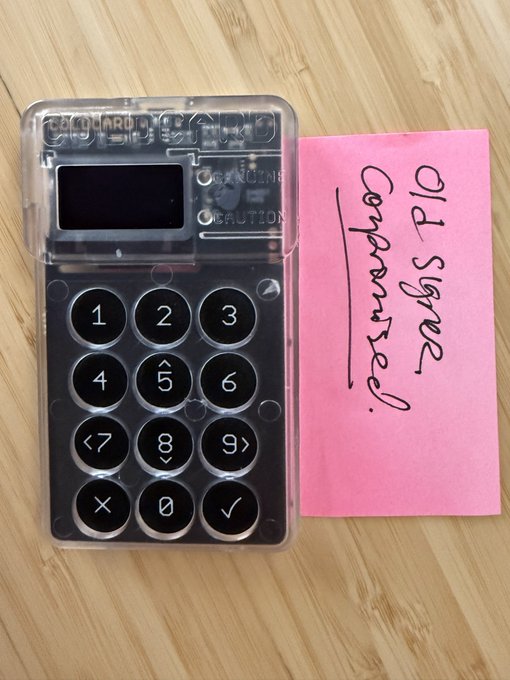 A transparent Cardputer device placed next to a pink sticky note with handwritten text 'Old Space Computer'.