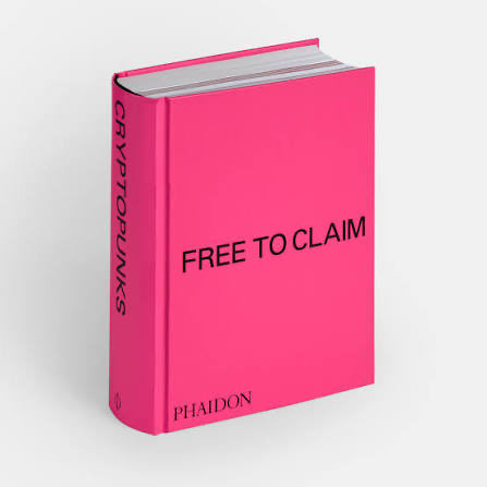 A pink hardcover book titled 'FREE TO CLAIM' with 'CRYPTOPUNKS' printed vertically on the spine and 'PHAIDON' at the bottom front.