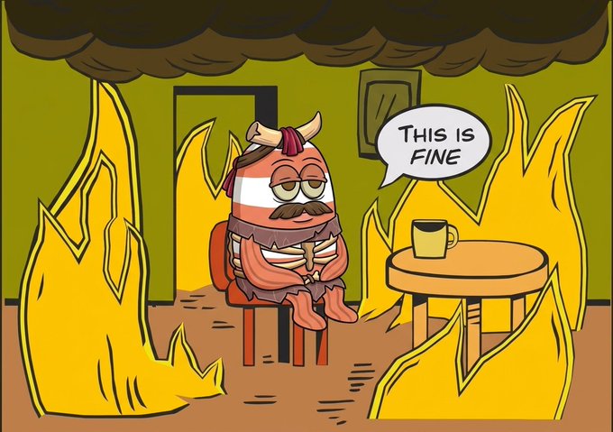 A mustachioed Viking character sits calmly in a burning room saying "THIS IS FINE," humorously echoing the post's sentiment of reluctantly accepting yet another turbulent season.