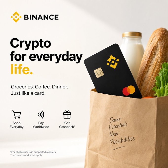 A Binance advertisement featuring the tagline "Crypto for everyday life" with a black Binance Mastercard and groceries in a paper bag that reads "Same Essentials, New Possibilities."