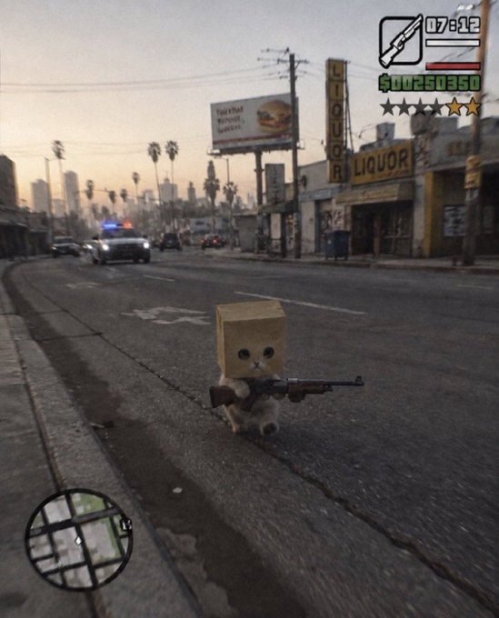 A screenshot from a Grand Theft Auto-style video game showing a small character with a cardboard box on its head holding a shotgun on a city street, with a minimap, weapon ammo counter (07812), and money display ($00250350) visible on the HUD.