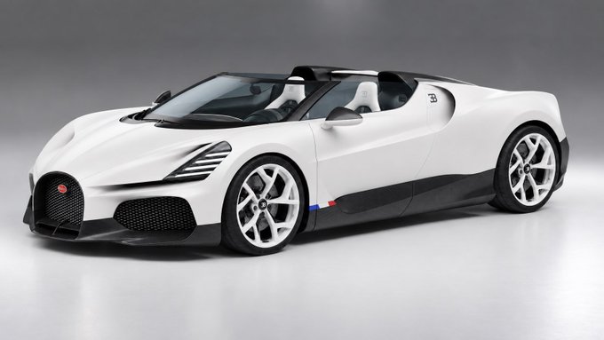 A studio photograph of a white Bugatti Mistral roadster sports car featuring black accents and a French flag decal.