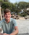 A young man smiles for the camera, likely the subject of the accompanying post detailing his impressive achievements in the Web3 space by the age of 28.