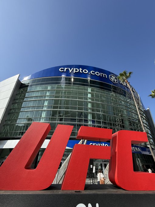 The image shows the Crypto.com Arena with large red "UFC" letters displayed in front of it, promoting the upcoming UFC 331 event at the iconic venue.