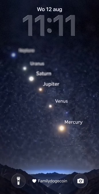 A smartphone lock screen displays the time 11:11 on Wednesday, August 12, with an image of a planetary alignment showing Neptune, Uranus, Saturn, Jupiter, Venus, and Mercury across a starry sky above mountains, tagged 'Familydogecoin'.