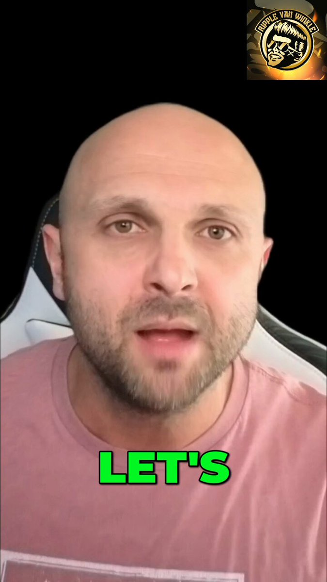 The image features a bald man wearing a pink shirt, with him talking about investing in Bitcoin. The text in the photo shows the hashtag #let's and reads "Let". This implies that there might be some sort of cryptocurrency discussion or event related to investing in Bitcoin taking place.