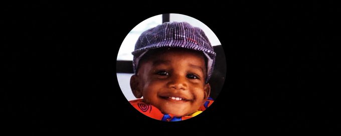 A smiling young child wearing a purple cap appears in a circular profile picture frame, representing the childhood photo used as Ansem's original PFP for his iconic Solana memecoin.