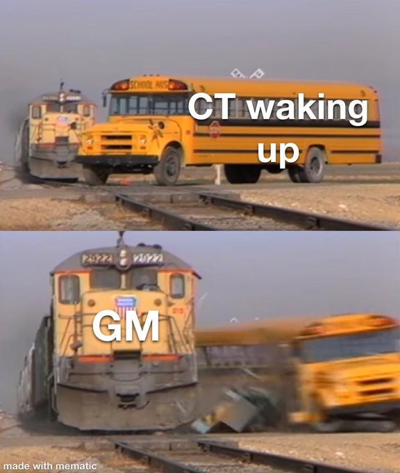 A “CT waking up” school bus approaches a locomotive labeled “GM,” setting up a train-versus-bus collision joke.