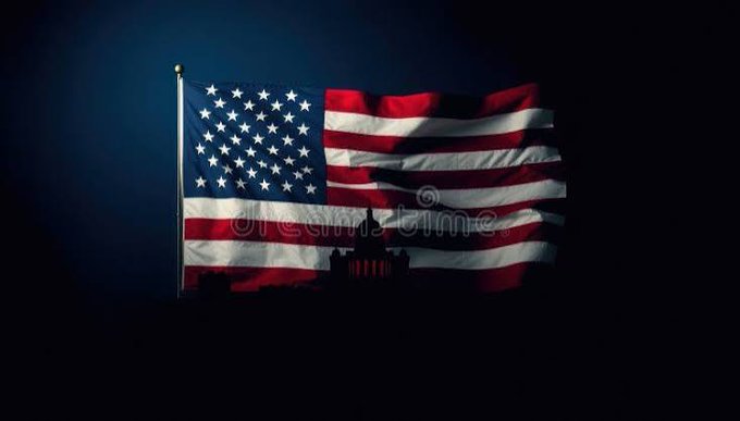 An American flag waving against a dark background with a silhouetted government building (resembling the U.S. Capitol) visible at the bottom.