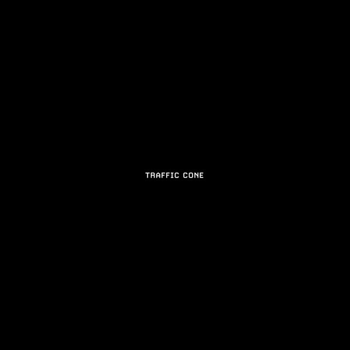 A black screen with the white pixelated text "TRAFFIC CONE" centered on it.