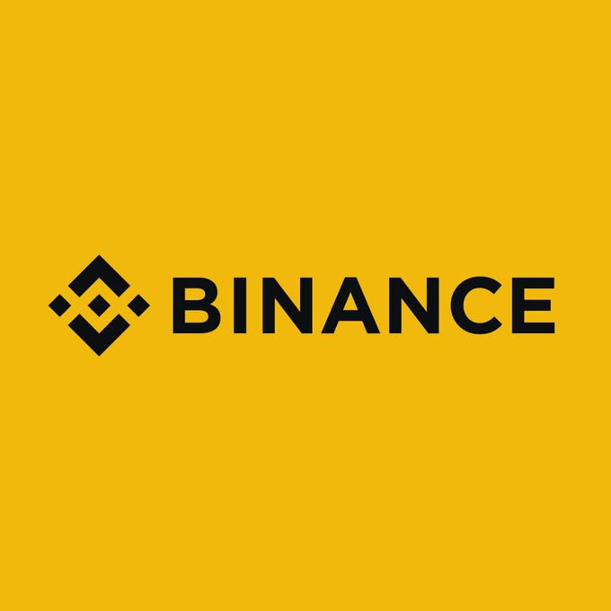 The image features a yellow background with the word "Binance" written in black letters, which is the main focus of the image. The text also includes information about Binance's upcoming launch of 7,000+ US Stocks & ETFs for non-US users and how to invest in them. The post emphasizes that these stocks are self-initiated on the BNB Chain and can be stored in a Custody account by Alpaca.