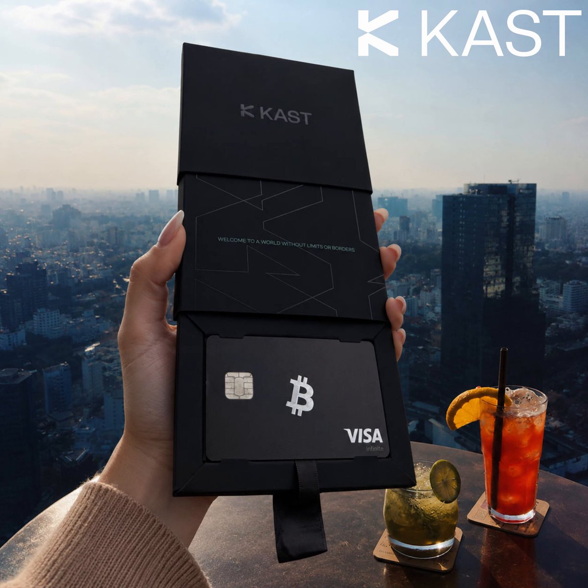 The image shows a person holding up a black wallet with a Bitcoin card inside, displaying its features such as the Visa logo and the Bitcoin symbol. The wallet appears to be opened or being held open by someone's hand. In the background, there are two drinks on a table, one of which is a cocktail glass filled with orange juice.