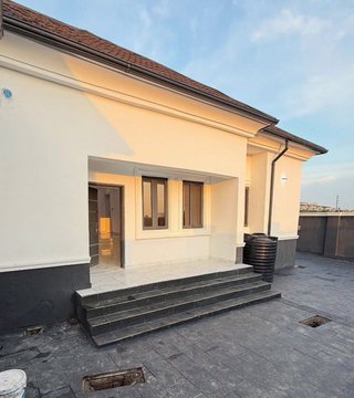 A newly completed parent house featuring a cream-colored exterior, stone steps, and a small front porch, ready to welcome its new owners. The image reflects the pride of completing a family home, aligning with the celebratory tone of the post.