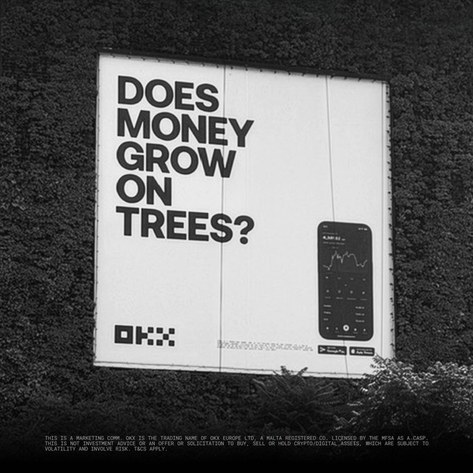 A billboard advertisement features the bold text "DOES MONEY GROW ON TREES?" alongside a smartphone displaying a trading chart showing 4,287.62, with the OKX logo at the bottom, capturing the brand's cheeky visual pun on cryptocurrency growth spotted in a public outdoor setting.
