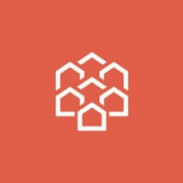 The image features a white geometric logo on a coral-red background, depicting seven interlocking house-shaped outlines arranged in a hexagonal cluster, symbolizing connected properties or a network of homes. This visual relates to the announcement of Pineapple Financial migrating billions in residential mortgage records onto the Injective blockchain, representing the digitization and interconnection of real estate assets onchain.