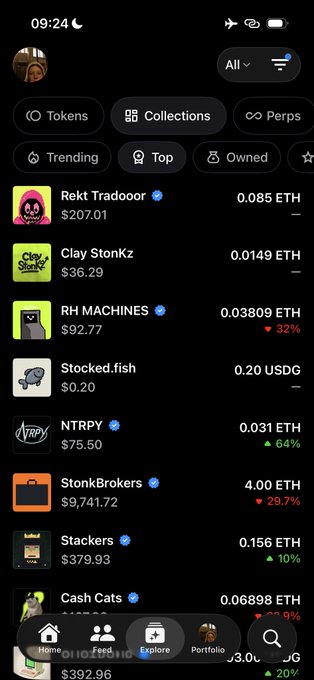 A screenshot of Robinhood's Explore page showing NFT collections including Rekt Tradooor ($207.01), Clay Stonkz ($36.29), RH MACHINES ($92.77), Stocked.fish ($0.20), NTRPY ($75.50), StonkBrokers ($9,741.72), Stackers ($379.93), and Cash Cats, illustrating the platform's NFT marketplace offering where users can browse trending digital collectibles priced in ETH and USDG.