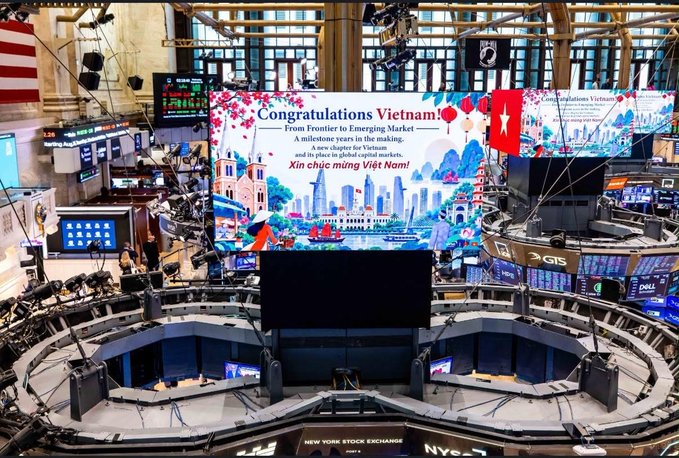 The New York Stock Exchange trading floor displays a large congratulatory banner reading 'Congratulations Vietnam: From Frontier to Emerging Market - A milestone years in the making' alongside a Vietnamese flag.