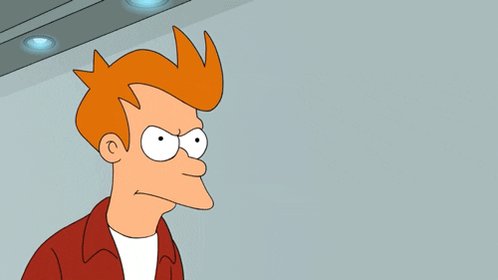 The image shows a cartoon male character with red hair wearing an orange shirt, standing against a plain white wall. The man looks into the camera and has a serious expression, with his eyes wide open as if he is surprised or angry about something happening in front of him. There are no texts present in the image, which makes it difficult to understand any additional context or instructions provided by the post author.