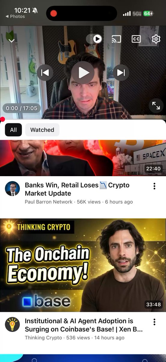 The image shows a cell phone screen displaying three different YouTube videos related to cryptocurrency and blockchain technology. The first video features an interview with Adam West, who is discussing the future of digital banking and lending. The second video showcases Patrick Gerhart, President of @telcoin Digital Asset Bank, talking about the potential of digital assets in the financial world. The third video provides a glimpse into what's coming next for finance, exploring innovative ideas and advancements in this field.