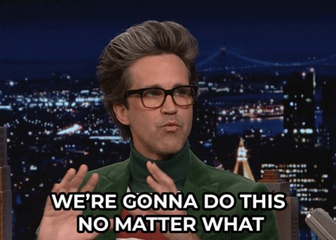 The image features a man wearing glasses, standing against a city skyline at night with buildings lit up by streetlights. The caption of the image reads "We're gonna do this no matter what", which seems to be a reference to the popular song "We're Gonna Do This" by Journey.