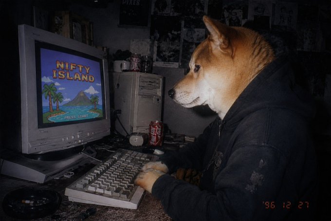 A Shiba Inu dog wearing a black hoodie sits at an old CRT computer displaying 'NIFTY ISLAND Press Start,' with a Coca-Cola can nearby, dated '96 12 27.