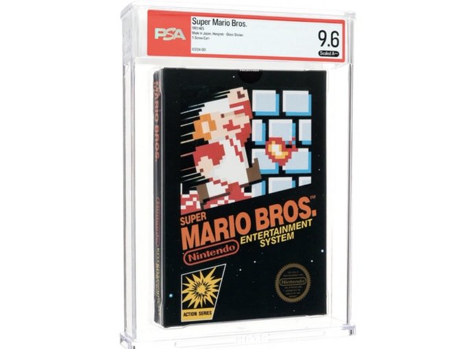 A graded PSA 9.6 copy of the original Super Mario Bros. NES game is displayed in a protective case, valued at $2 million. The image illustrates how rare physical collectibles have continued appreciating into 2024, contrasting with the NFT market whose record sale prices have stagnated since 2021.