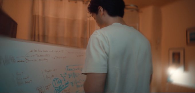 A person in a white t-shirt stands in front of a whiteboard covered in handwritten notes and equations, including visible text like "TO DO," "Random number," and "TAR," appearing to plan out a complex project. The image aligns with the post's announcement of an upcoming launch on @stardotfun, symbolizing the behind-the-scenes strategizing and idea development that precedes launching a new venture like internet rounds.