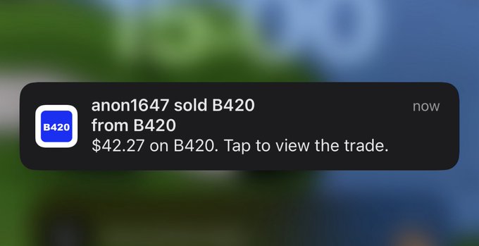 A smartphone notification displays the message: 'anon1647 sold B420 from B420 $42.27 on B420. Tap to view the trade.'
