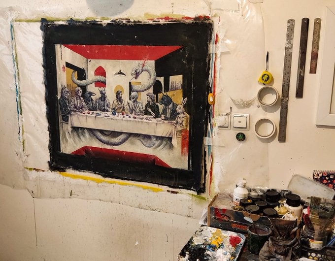 The image shows an artist's studio with a painted reinterpretation of Leonardo da Vinci's "The Last Supper," where the figures are replaced with rabbits and other animals, surrounded by paint supplies, brushes, and a ruler. The post's mention of NFTs aligns with the artwork's unique, potentially digital-style creative remix that could appeal to the NFT art community.
