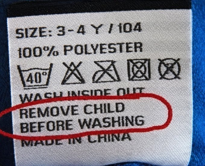 A clothing label showing size 3-4 Y/104, 100% polyester, made in China, with the ironic instruction 'REMOVE CHILD BEFORE WASHING' circled in red.